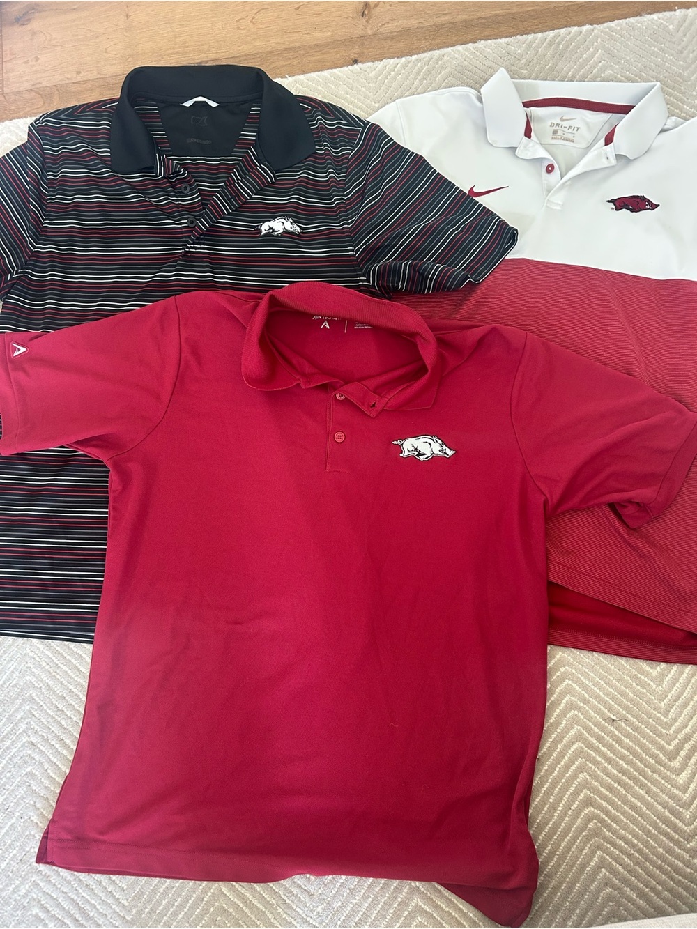 Antigua and Nike University of Arkansas Polo